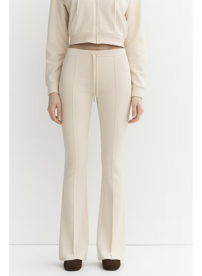 Women's Beige High-Waisted Flared Pants Soft Cotton Interlock | Elegant Fit with Drawstring