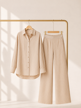 Beige striped linen-blend women’s loungewear set by Soft Steps, featuring button-down shirt and straight-leg pants, styled on hanger with minimalist luxury fashion look